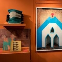 Mur présentant une photo du Burkina Faso et un cahier de notes